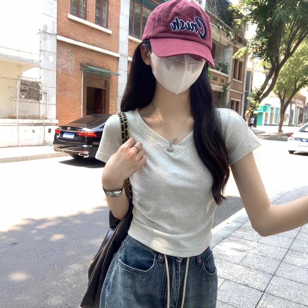 Short-sleeved T-shirt women's summer new Korean version slim and thin versatile v-neck design sense solid color front shoulder top trendy