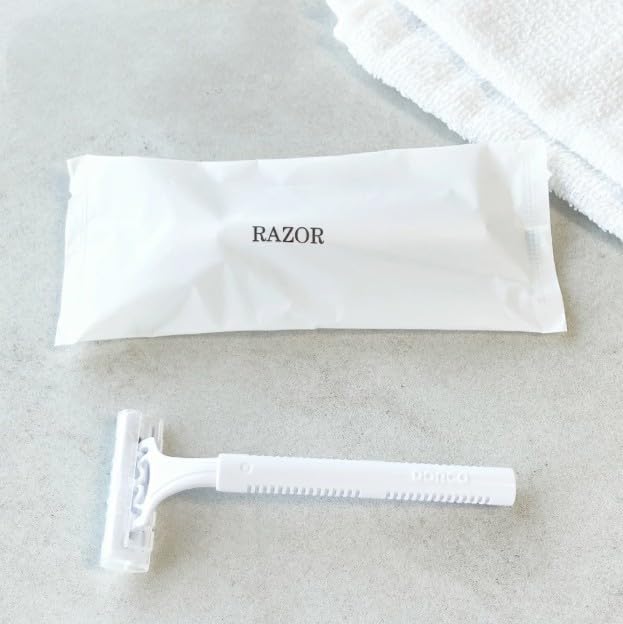 RAZOR a disposable commercial razor for beards and other hair (600), (double-bladed) removal.