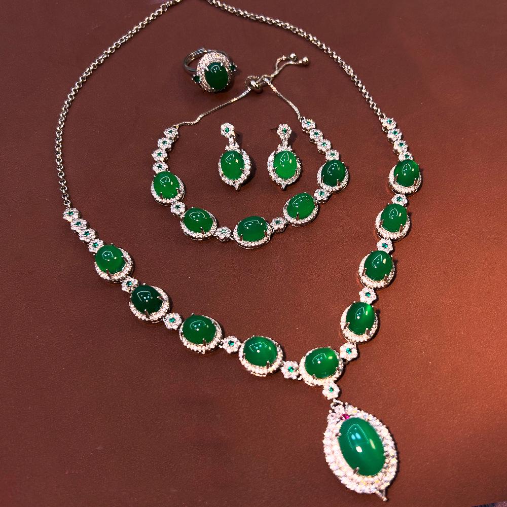 

Винтажный китайский ювелирный набор из сапфира и халцедона: Коллекция из четырех предметов высокого класса с посеребрением и медным покрытием