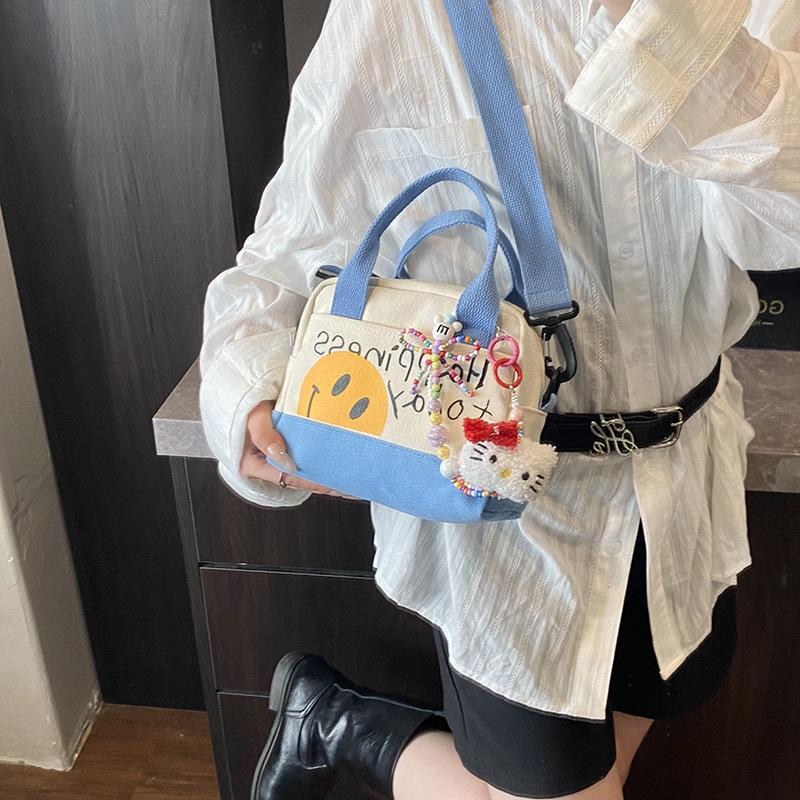 Cute Smiley Girl Handbag Hand Carry Out High Value Canvas Bag Korean Version Printed Trend Shoulder Messenger Bag