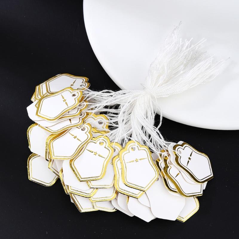 Förpackning med 500 st Guld/Silver Pappersstjärna Formade Prislappar Stadigt Papper Förstansade Hål För Detaljhandel Smyckesdisplay Festdekorationer