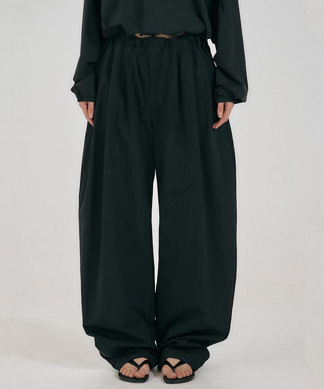 Sseodeupeulojegteu Curve Drawstring Pants Black