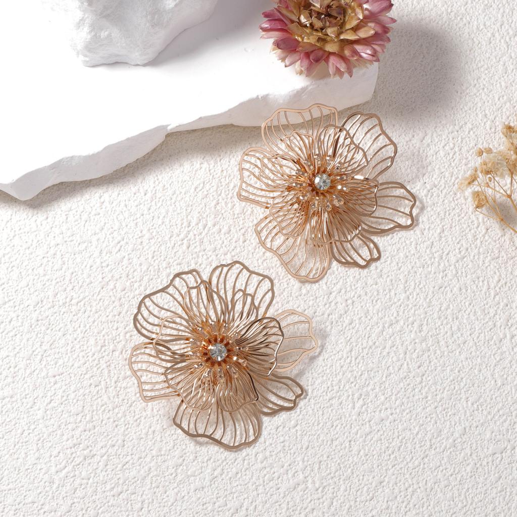 Bohemian personality retro trend metal hollow flower stud earrings creative unique senior design sense