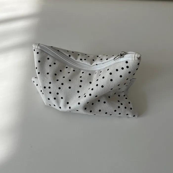 White polka dot pouch