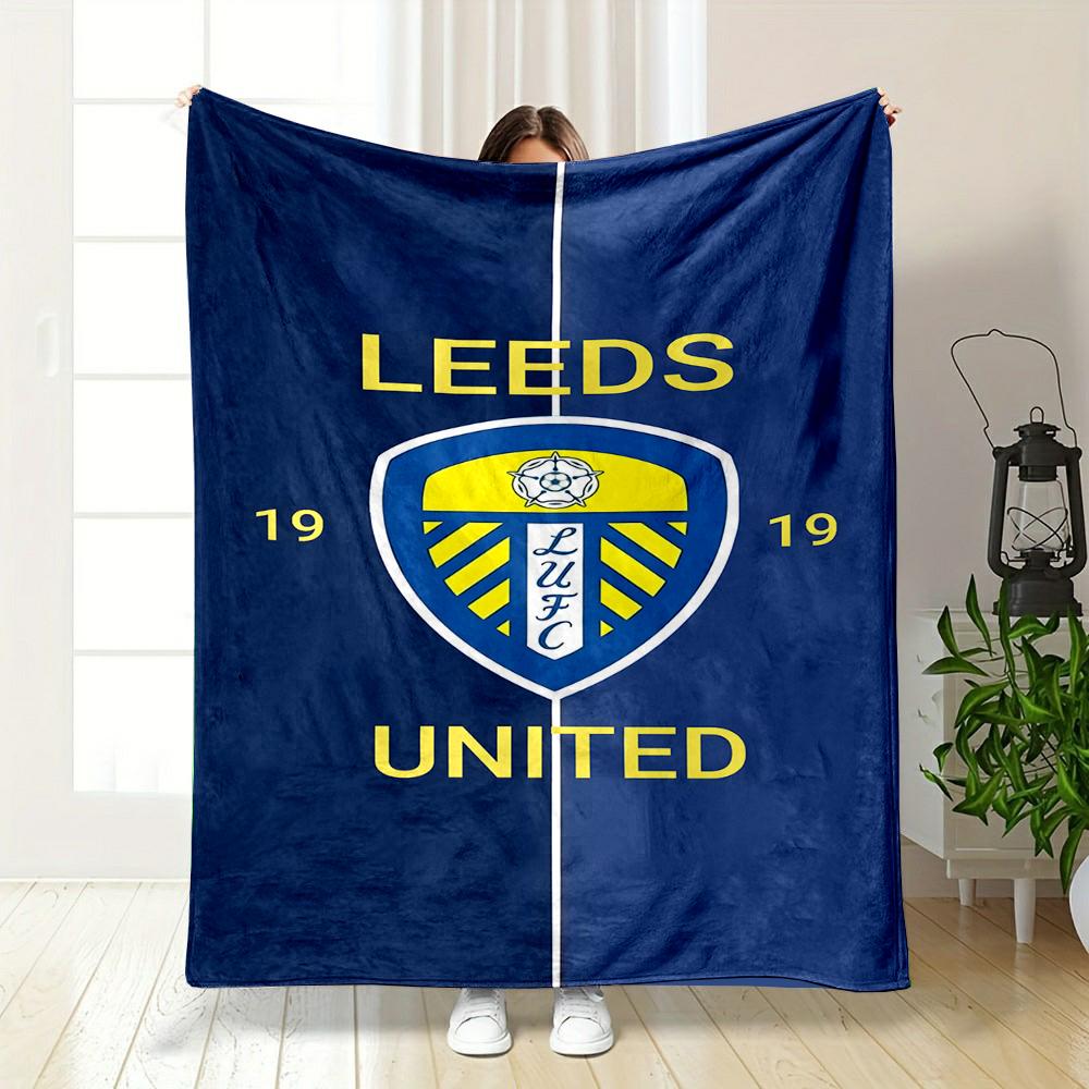 Leeds United Blue and Yellow Logo Blanket Patterned flannel blanket perfect for the bedroom living room, sofa, or a little nap