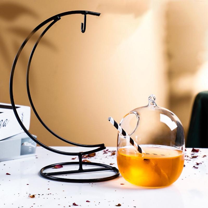 One individual drink, glass of water, hanging cocktail, creative glass.