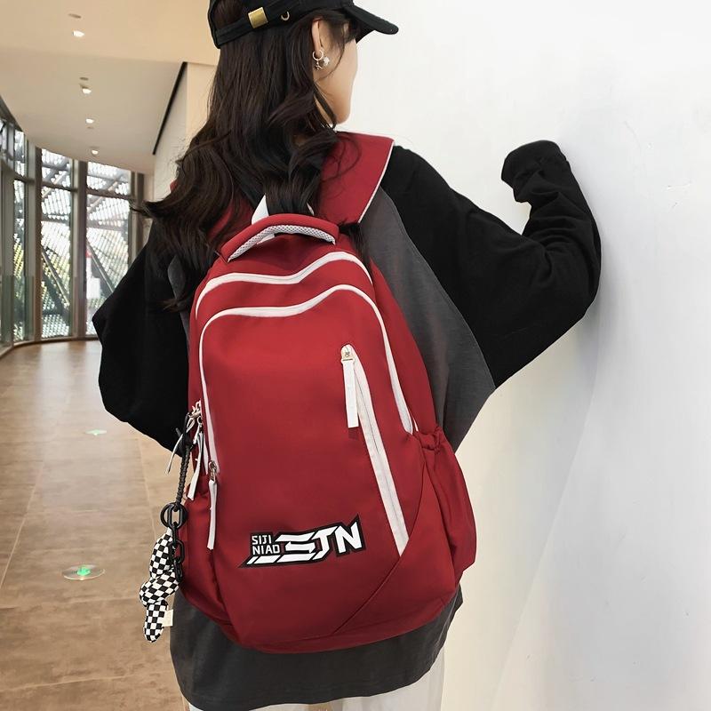 Backpack High-value schoolbag University women s simple and versatile college style backpack Lightweight and ultra-light travel bag красный