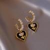 Elegant Gold-Plated Black Zircon Stud Earrings - Niche Design for a Luxurious Fashion Statement