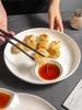 Kreativ dumplingtallrik i japansk stil med såsskål