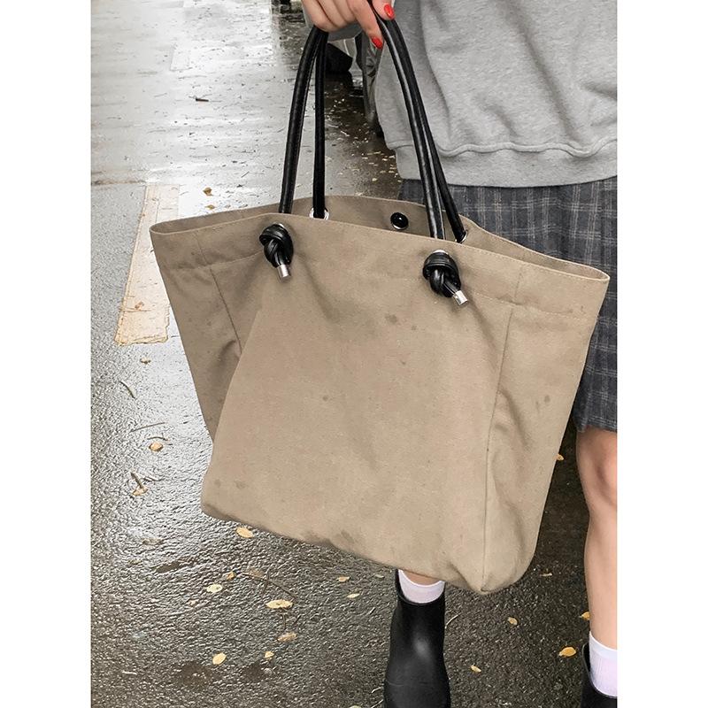 

Retro simple large-capacity bag women s 2025 new solid color canvas bag versatile shoulder underarm bag one piece hair хаки