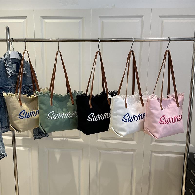 New Letter Tassel Canvas Bag Women's Versatile Largecapacity Simple Commuter Student Shoulder Tote Bag