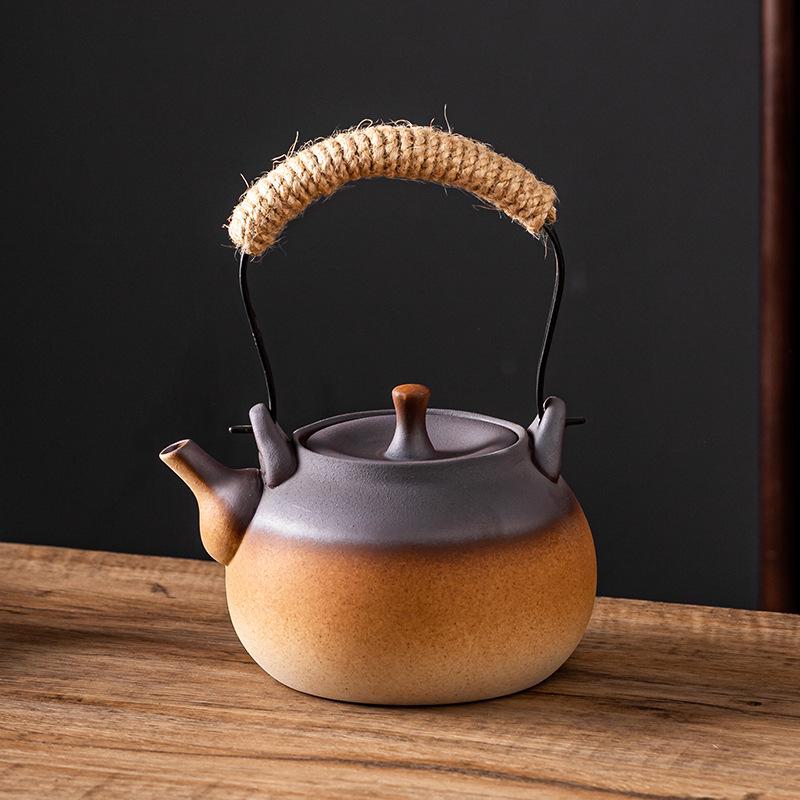 Ceramic Kung Fu Tea Set: Black Teapot with Side Handle and Charcoal Stove for Open Fire.
