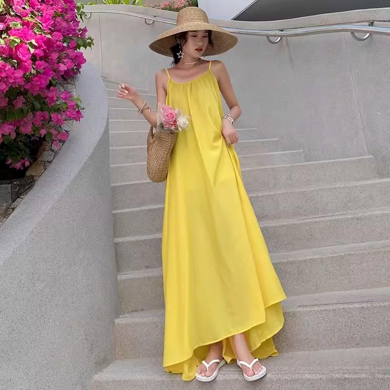 Seaside Vacation Sexy Backless Suspender Dress Women's Summer New Loose A-word Skirt Gentle Yellow Long Skirt
