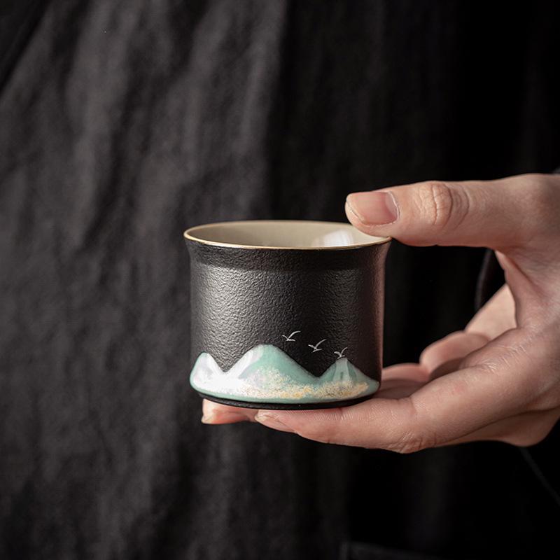 Hand-Painted Black Pottery Zen Tea Cup - Retro Mountain Design, Kung Fu Ceramic Masterpiece for Tea Tasting and Guest Reception.