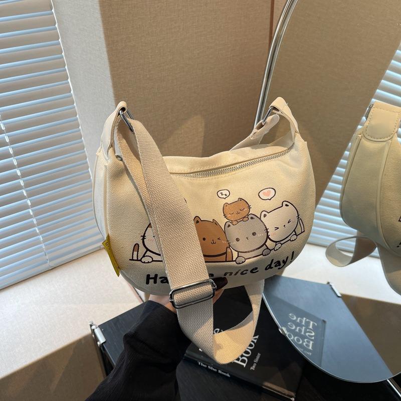 Niche Design Canvas Dumpling Bag Women's New Cartoon Printed Shoulder Bag Versatile Messenger Bag