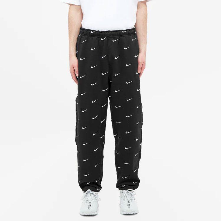 Nike Spodnie z logo Swoosh na całej powierzchni CJ8905-010