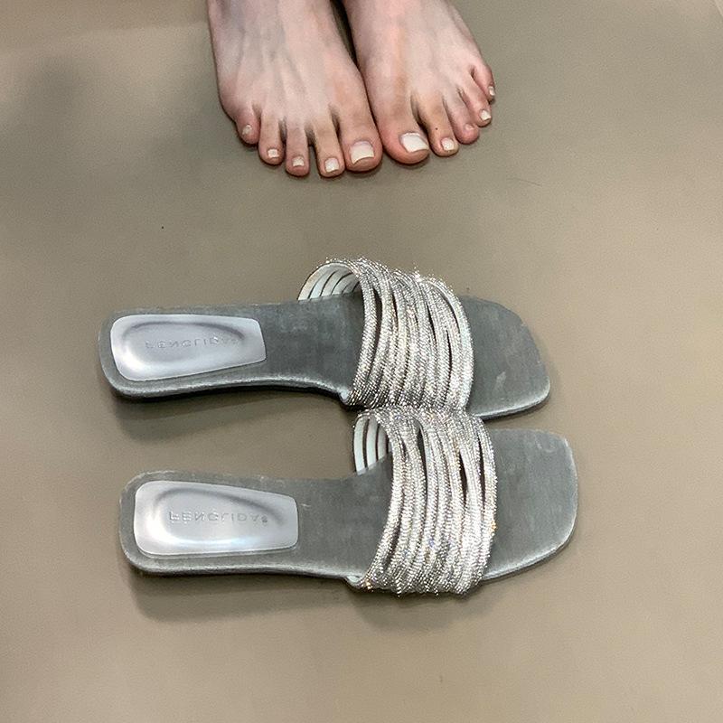 Fashion one-word slippers women's 2025 summer new outer wear lazy rhinestones with low heels open-toed sandals high sense