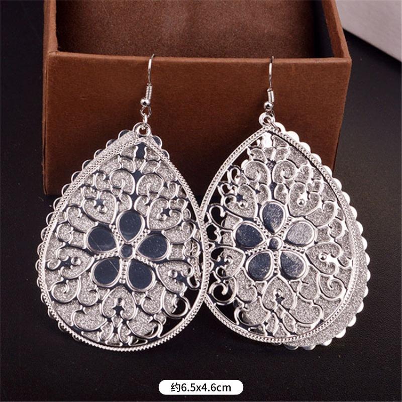Fashion exaggerated niche temperament fringed earrings retro personality versatile sequined earrings women's long ear jewelry