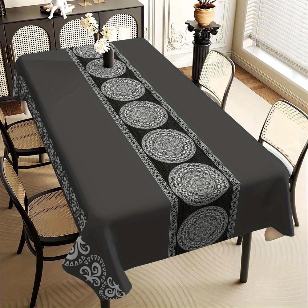 One rectangular tablecloth with a luxurious black and white floral print - made of durable polyester fabric.
