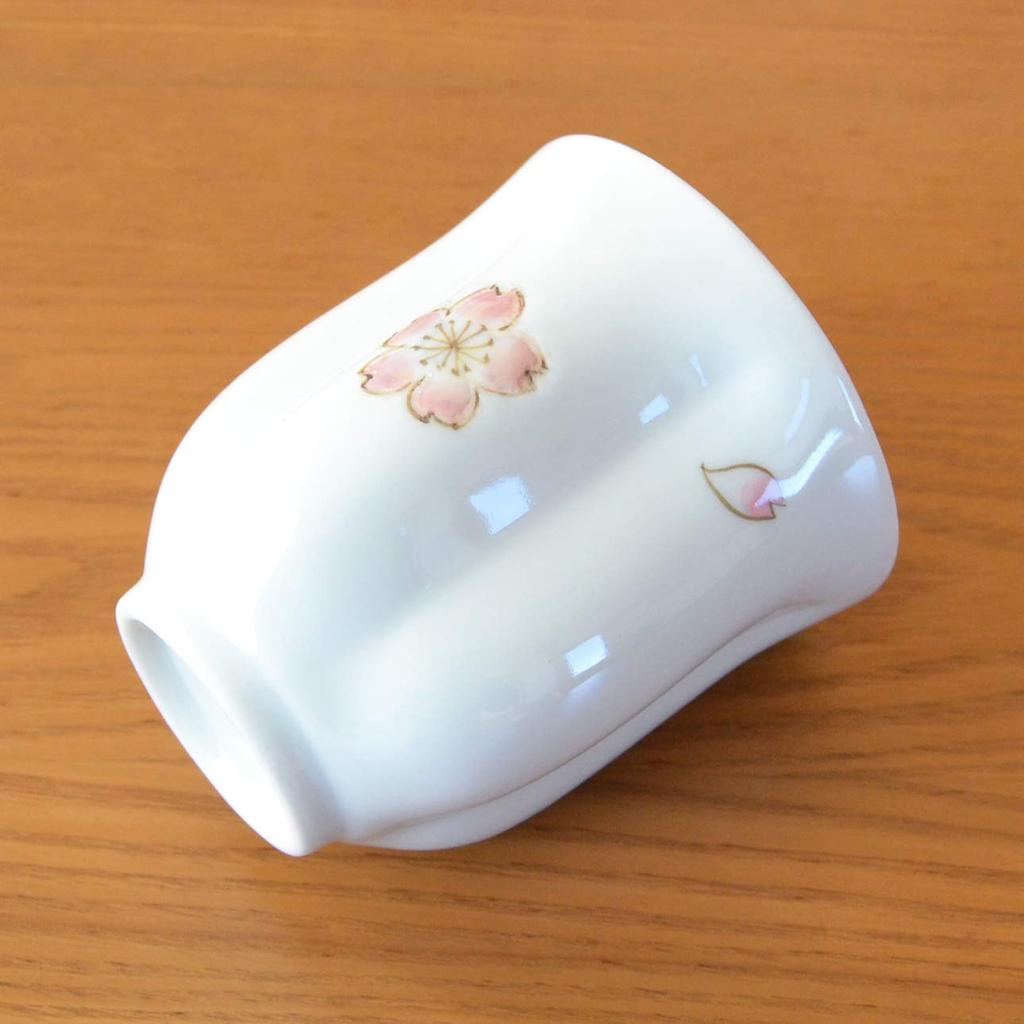 A perfect retirement gift for A pink teacup shaped like a cherry blossom Made in Made in Arita blossom Comes in a wooden women. petal. Japan. ware.