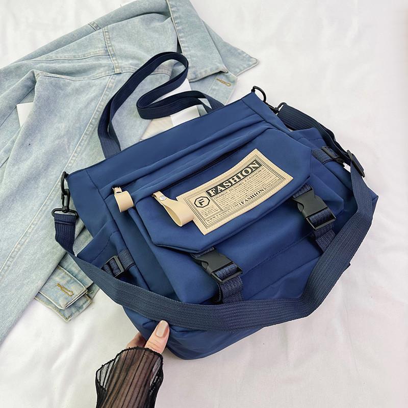 

Stylish Large Capacity Tote Bag For Students In Black Red Blue And White Colors синий