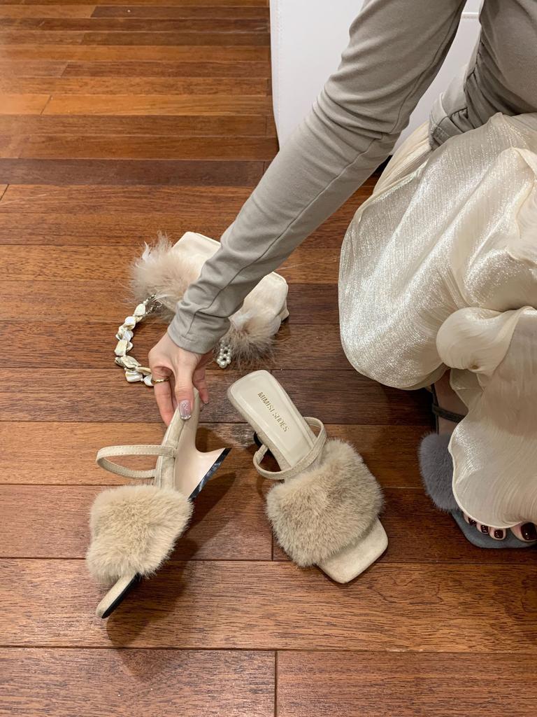 In the autumn and winter of 2025, the new European and American wedges with French square head open-toed fluffy slippers are worn outside women's sh