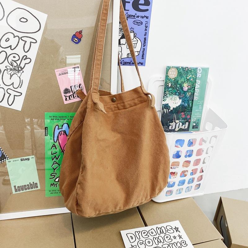 

Japanese lazy style literary and artistic large-capacity canvas bag female solid color simple versatile shopping bag student class shoulder bag коричневый