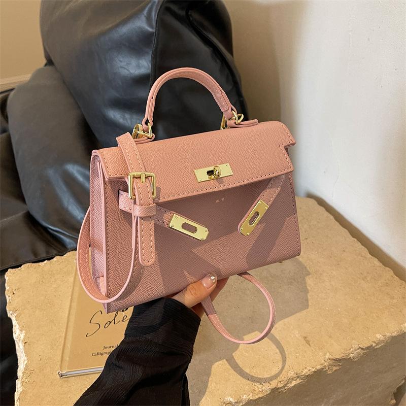New fashionable solid color cross pattern portable shoulder oblique span trendy women's bag