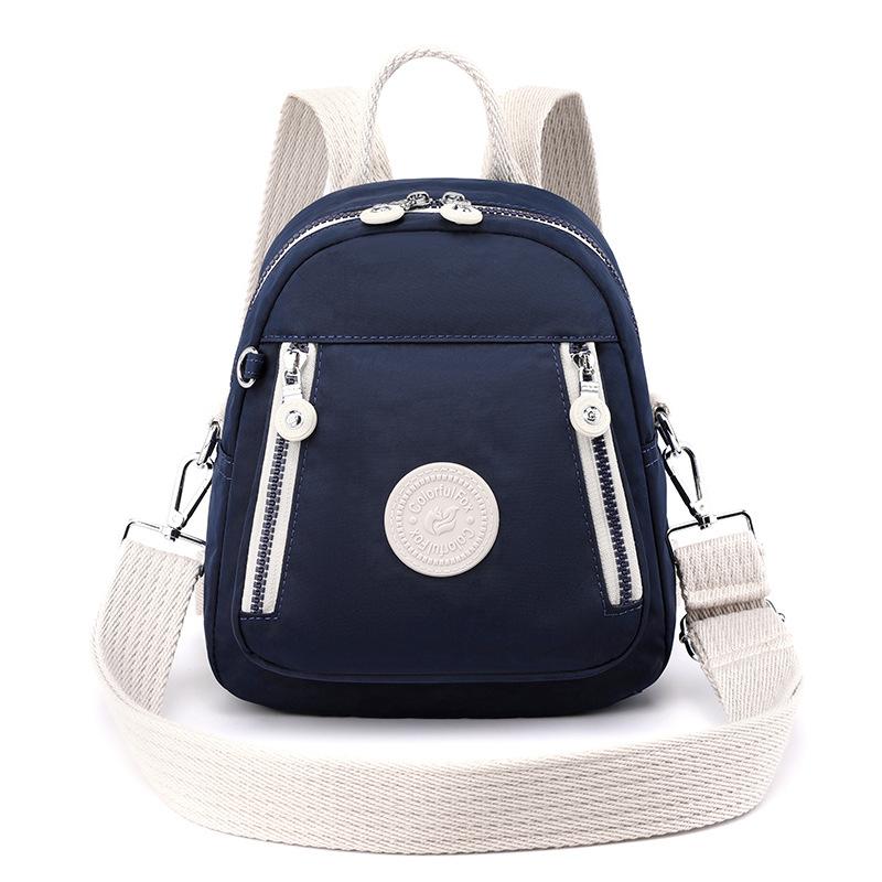 

New European and American retro messenger bag women s contrasting color multi-functional backpack nylon mobile phone key change bag темно-синього кольору