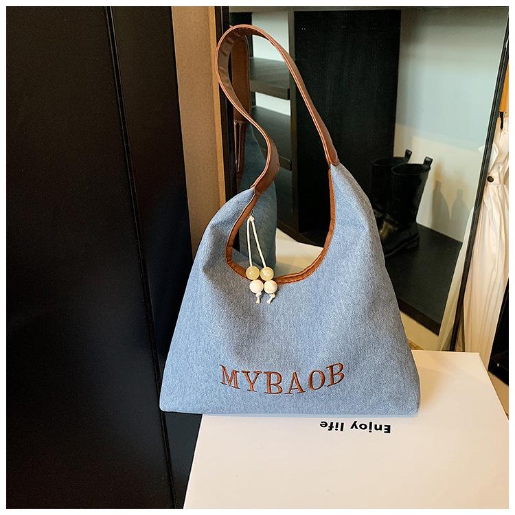 

Leisure commuter bag women s large capacity 2024 new autumn and winter versatile shoulder shopping bag texture tote bag синій