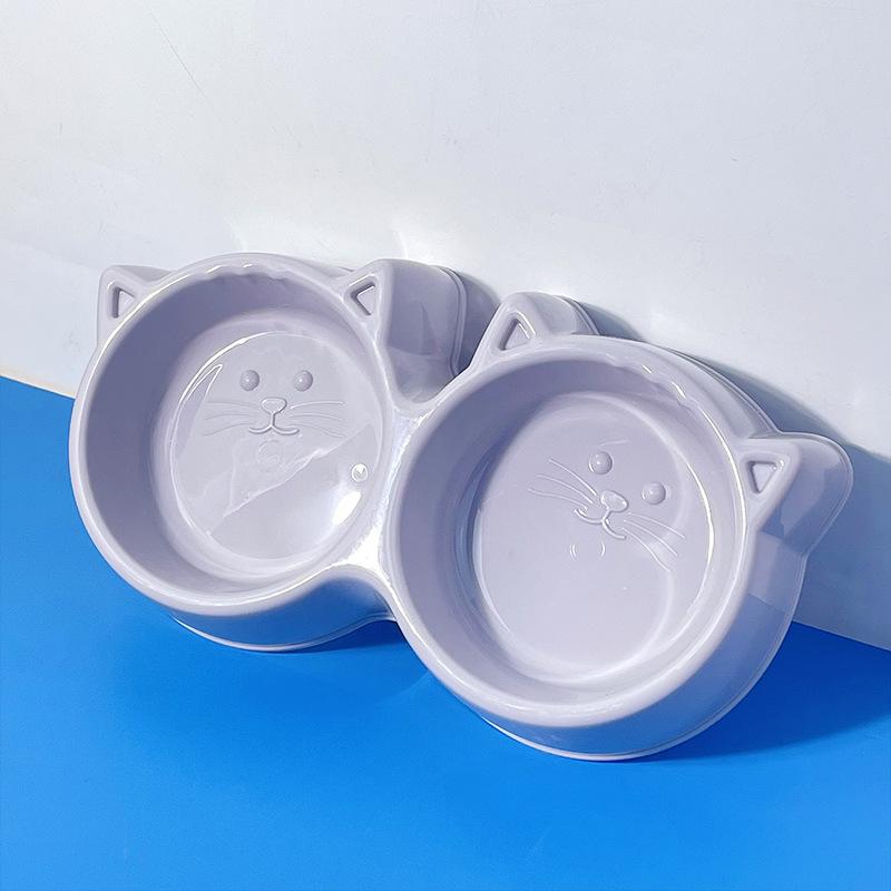 

Миска для кошек двойного назначения с защитой от проливания: Дизайн в виде круглой кошачьей мордочки, защита шейного отдела позвоночника, легко моющаяся двойная миска для еды и воды.