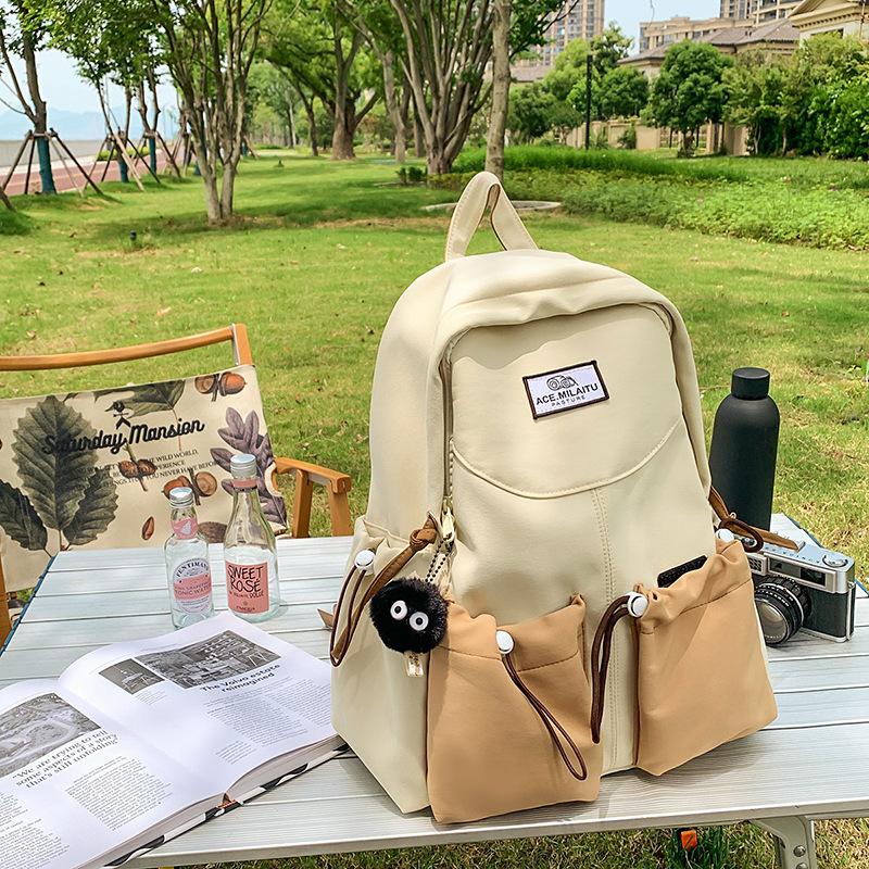 New high-value college-style men's and women's schoolbags, Korean version school students, contrasting colors, casual commuting, versatile backpack.