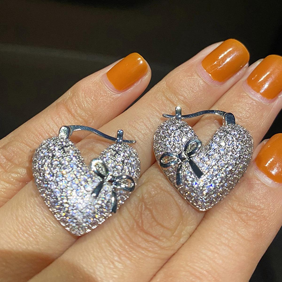 Elegant Micro-Paved Heart-Shaped Huggie Earrings with Bow Detail