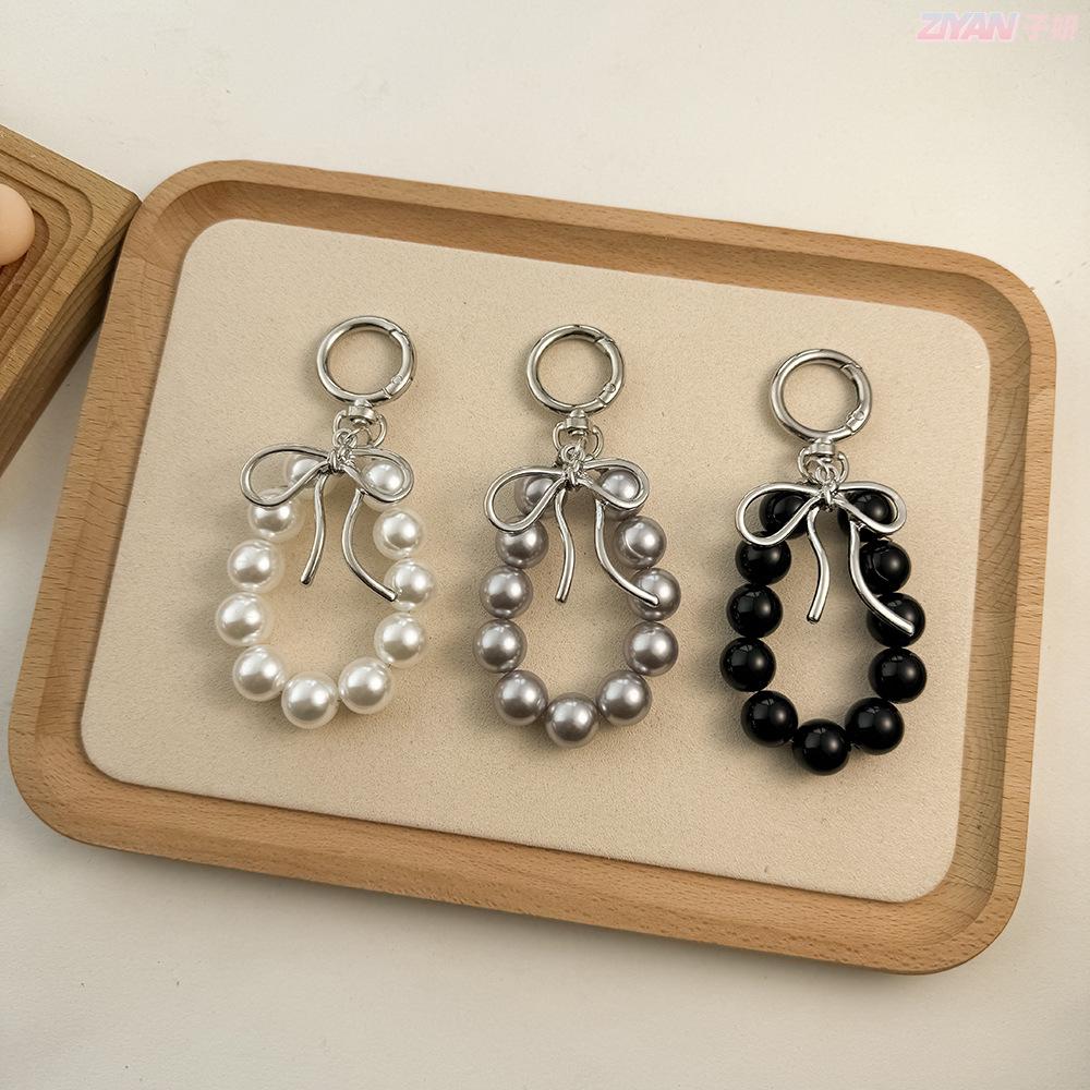 Korean Style Keychain Pendant: Metal Irregular Bow with Pearl Beads for Phone or Bag Accessories
