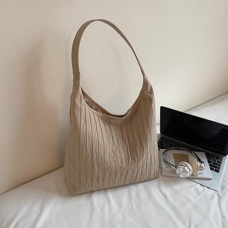 

2025 summer new tote large-capacity bag women s travel commuting single shoulder fashion niche hand-held underarm bag хаки