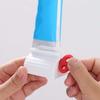 Rolling Tube Toothpaste Squeezer Toothpaste Seat Holder Stand Rotate Toothpaste Dispenser Bathroom 1PC