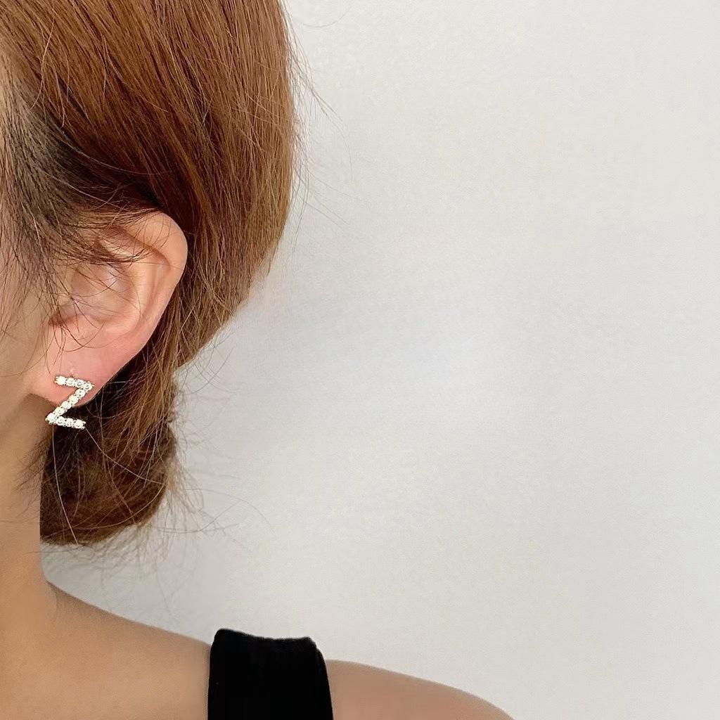 Korean Micro-Diamond Trendy Letter Stud Earrings: Elegant, High-End Accessories for Women's Unique Style.