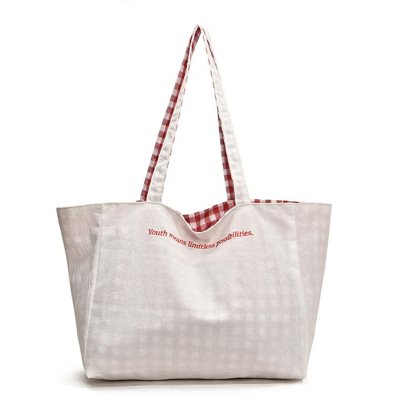 Frühling und Sommer Neue doppelseitige karierte Tragetasche mit großem Fassungsvermögen für Studenten, Pendler und Freizeit, Schultertasche