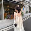 Französisches sanfter Wind Hosenträgerkleid Damen Sommer Neu Meeresurlaub Strandkleid Nischen-Design Langes Kleid