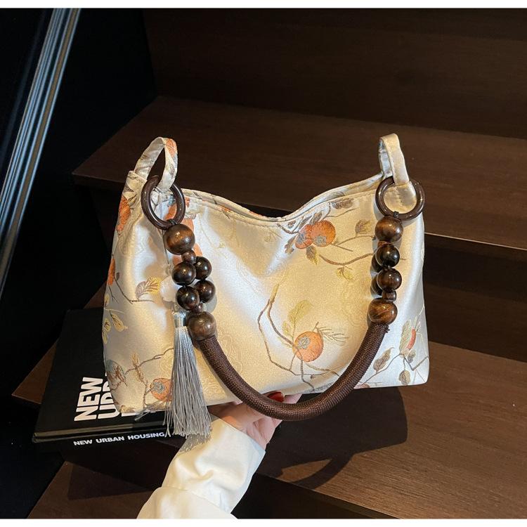 

Вышитая холщовая сумка женская лето 2025 новый нишевый дизайн плечевая сумка под мышку бежевый