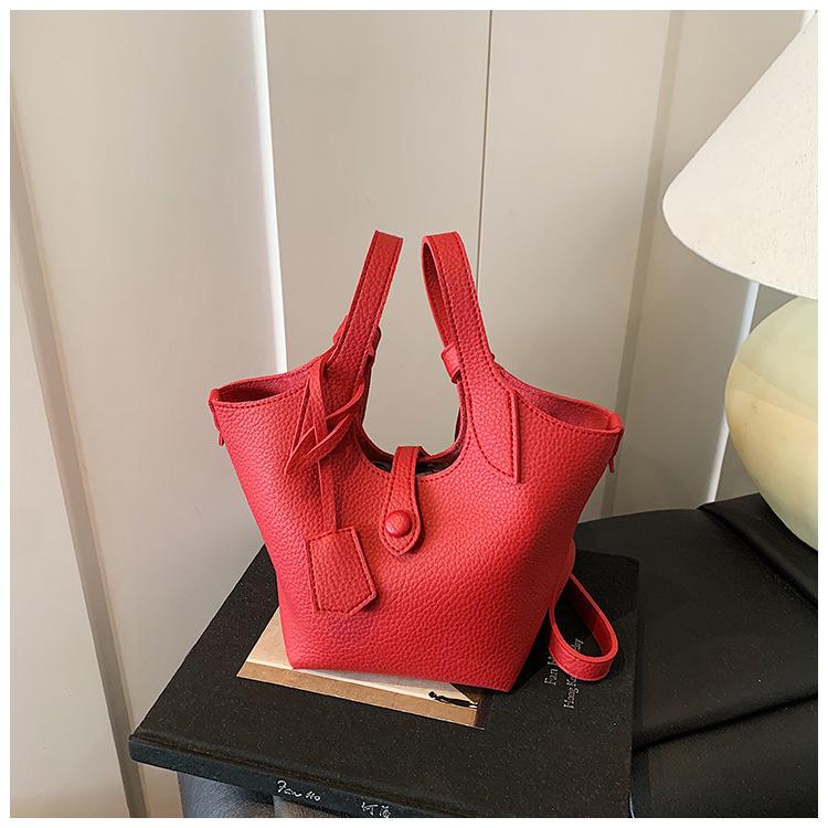 Wholesale 2025 new niche lychee pattern handbag bag women's Korean version simple bucket bag casual messenger bag