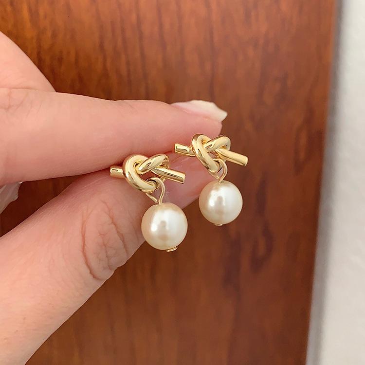 Elegant Retro Metal Pearl Knot Stud Earrings for Women - Unique, High-End Fashion Jewelry