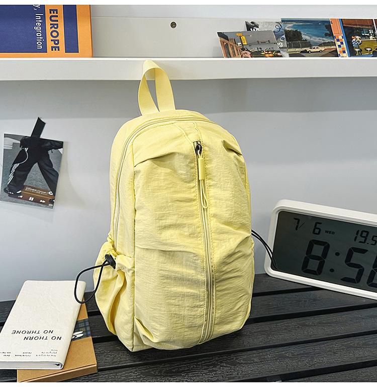 School bag Solid color outdoor mountaineering waterproof pleated backpack Lightweight leisure travel messenger bag Niche versatile simple breast bag