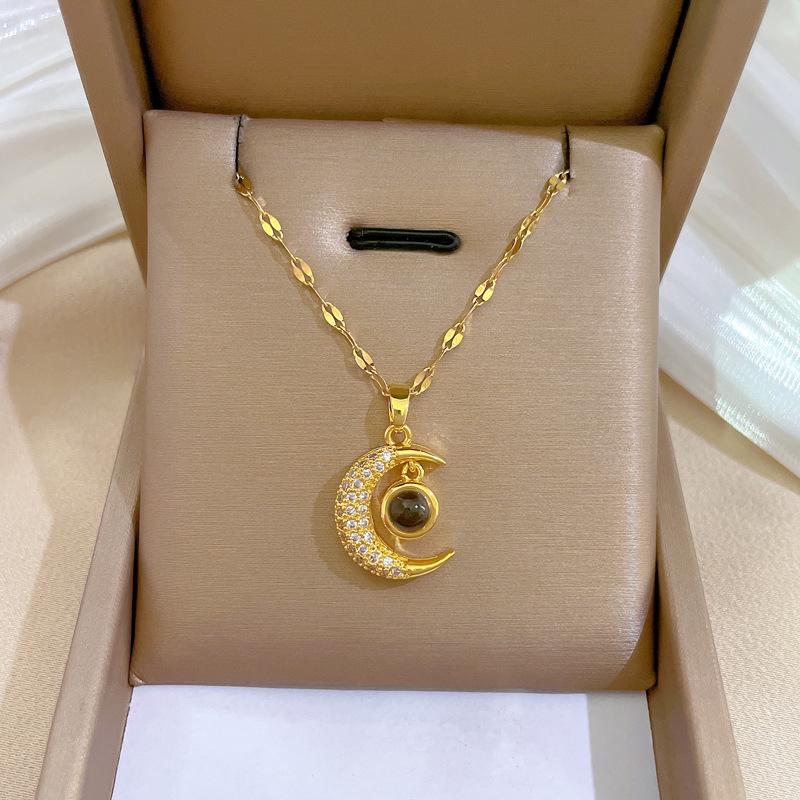 Titanium Steel Moon Pendant Necklace: Elegant Full Diamond Micro-Pave Design, Sparkling and Stylish for Women.