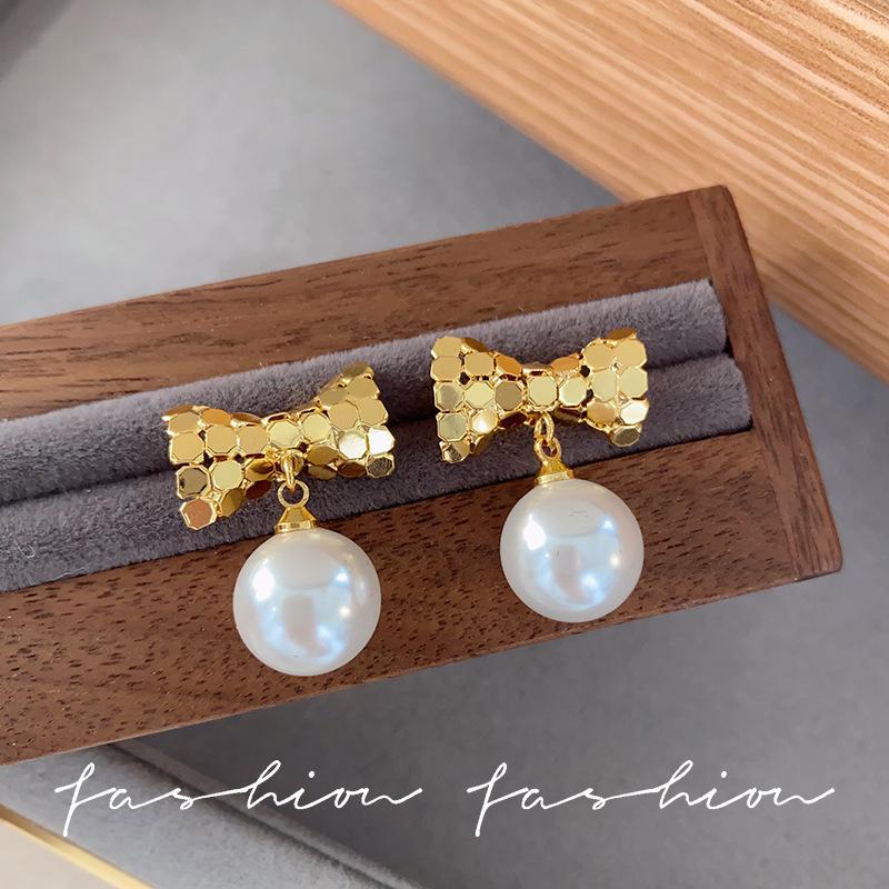 Sterling silver needle geometric splicing bow glass pearl earrings women s European and American style elegant and unique earrings tide