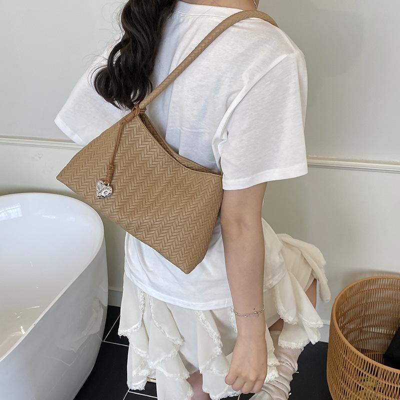 Sommer neue Nische Temperament High-End Handtasche Mode gewebte Tasche Schulter Unterarm Eimer Tasche