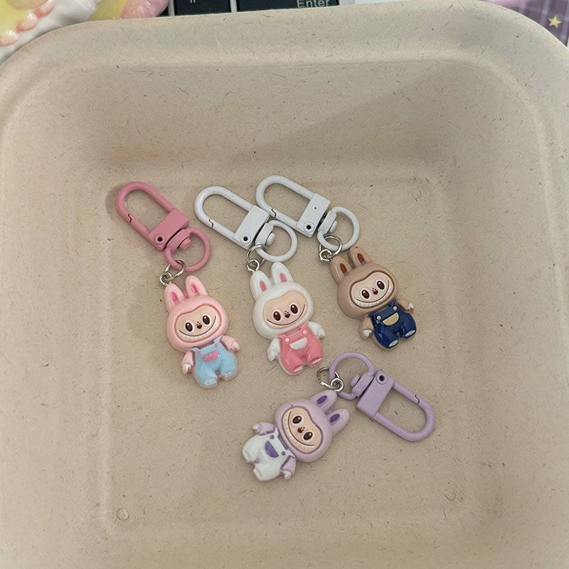 Niedliche Latzhose zum Hochziehen Anhänger Niedlich Cartoon Studenten Tasche Anhänger Geschenk