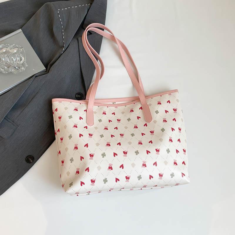 The new beautiful and fresh summer popular versatile large-capacity students commute to class versatile portable shoulder armpit bag