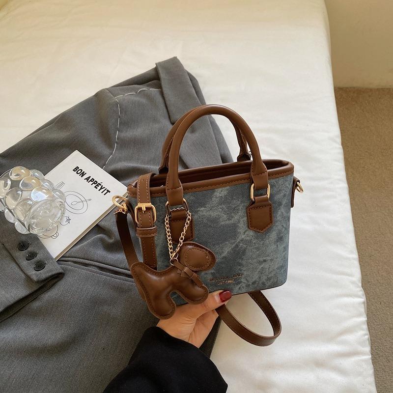 Textur trendige Nischentasche Herbst neu retro Schulter Umhängetasche Mode tragbare Eimertasche Damen