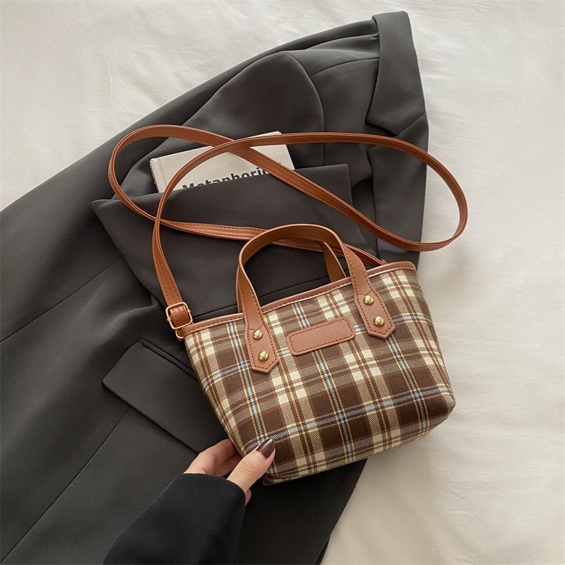 Light luxury plaid portable bucket bag women's classic niche design foreign-style texture shoulder messenger bag